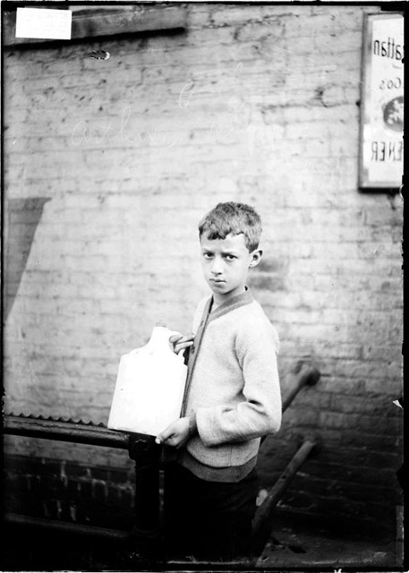 Arthur Tesler, a Boy, Carrying a Jug in a Bar