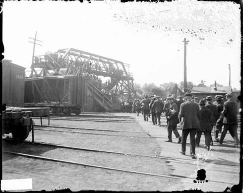 Crowd of Men Walking Through a Railroad Yard During a Railroad Strike
